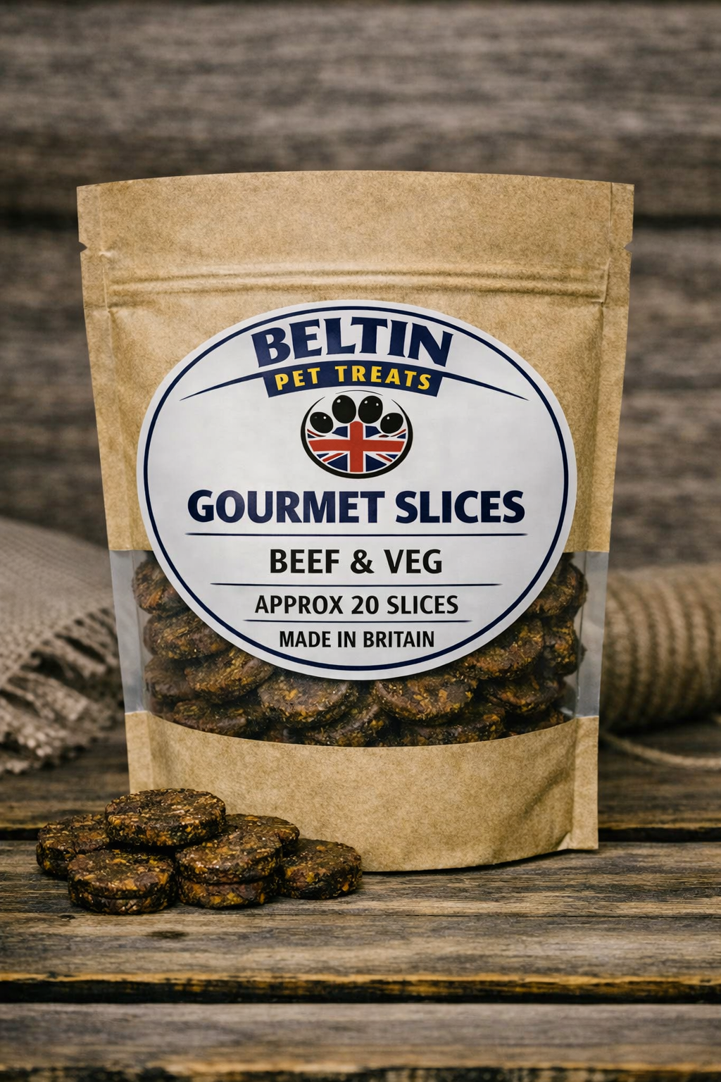 A stand-up kraft paper pouch of Beltin Gourmet Slices Beef & Veg pet treats on a rustic wooden surface, with a few slices placed in front and a burlap sack blurred in the background.