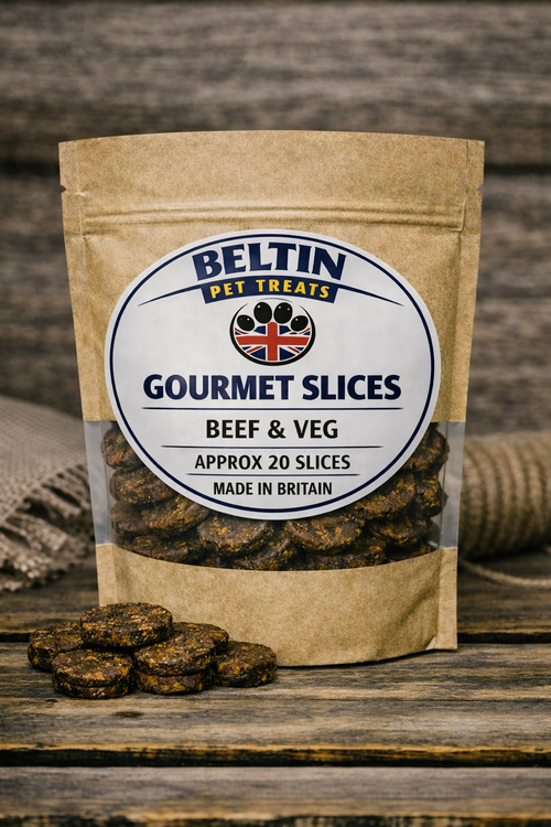 A stand-up kraft paper pouch of Beltin Gourmet Slices Beef & Veg pet treats on a rustic wooden surface, with a few slices placed in front and a burlap sack blurred in the background.