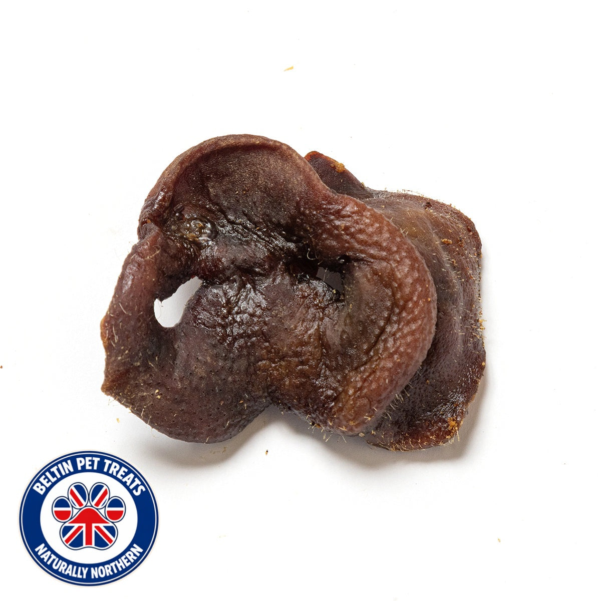 A single dark brown, textured dog treat on a white background with a 'Beltin Pet Treats Naturally Northern' logo in the bottom-left corner.
Details